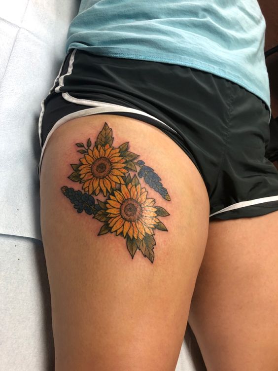 Why Not Be Glamorous And Powerful With Sunflower Thigh Tattoo