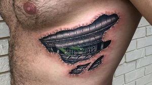 Biomechanical tattoo on the left side of the chest