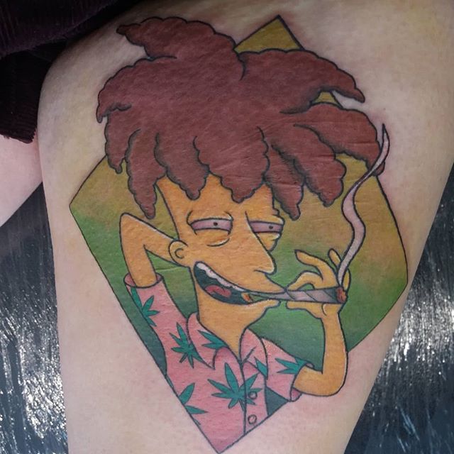 Cartoon tattoo of Sideshow Bob smoking a cigarette on the left leg
