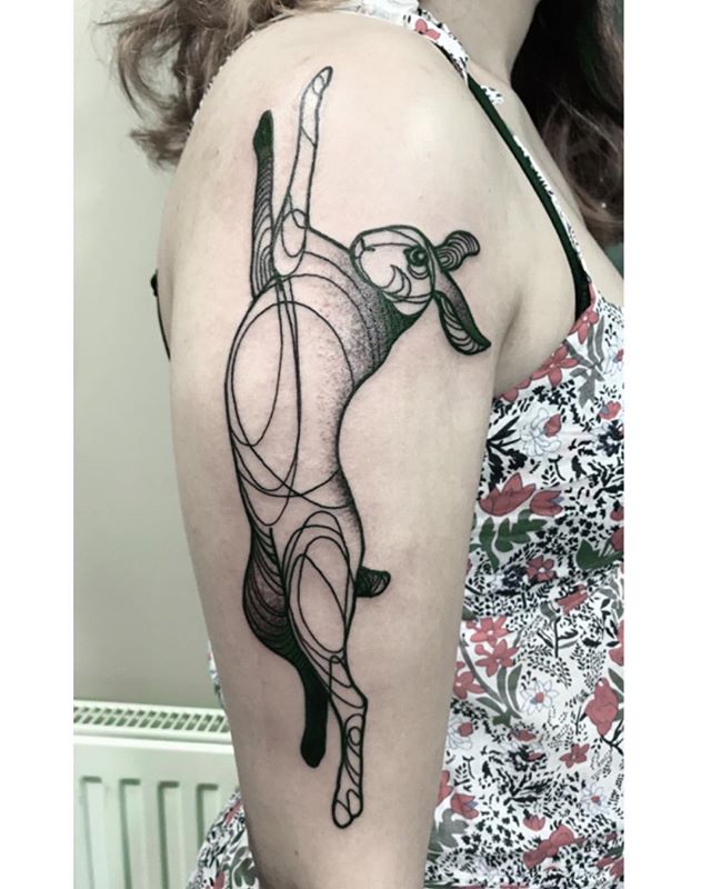 Dot work tattoo of a rabbit on the right hand