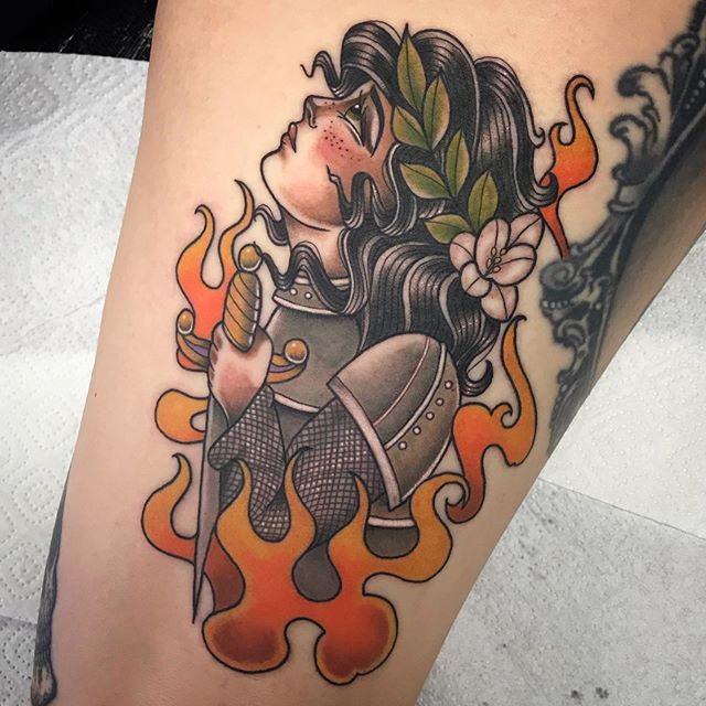 Traditional color tattoo of a girl on the hand