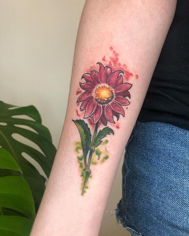 Water color tattoo of a flower on the right hand