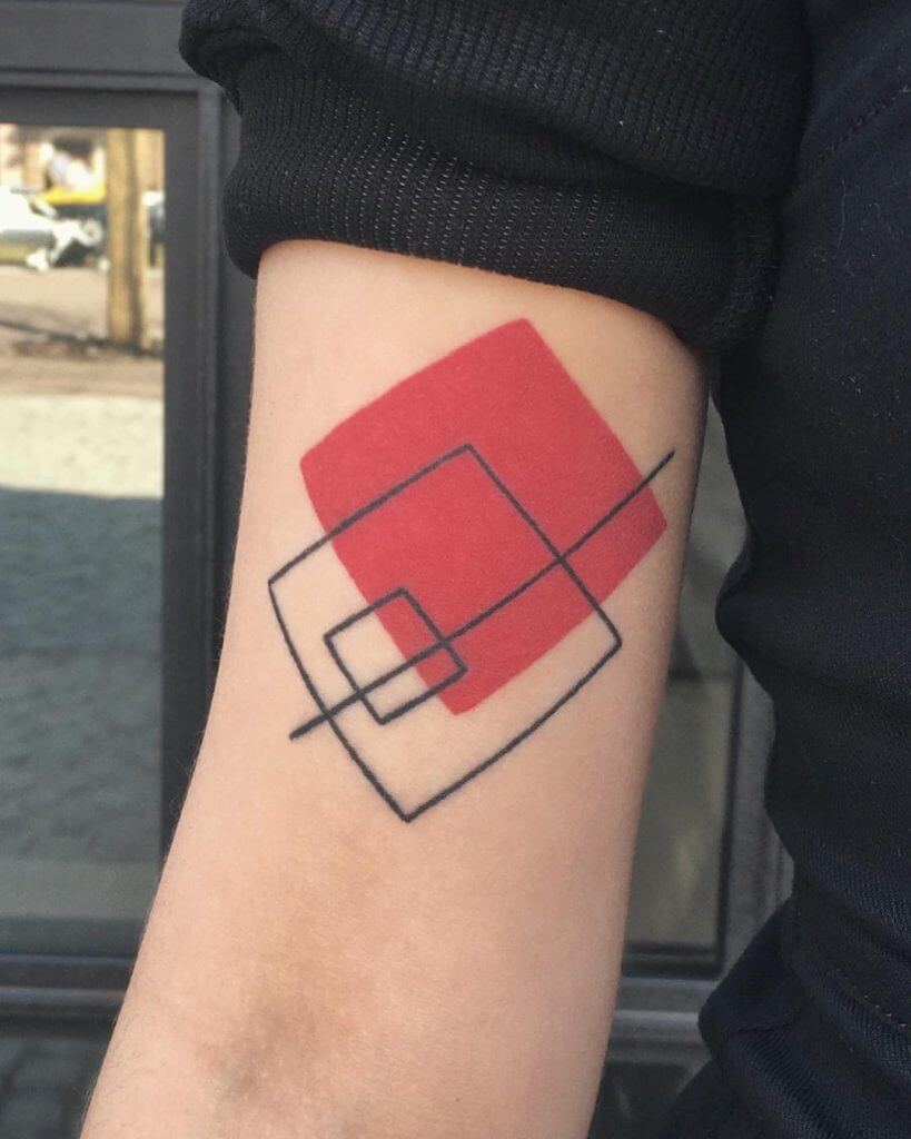 Abstract tattoo of squares and a line on the hand