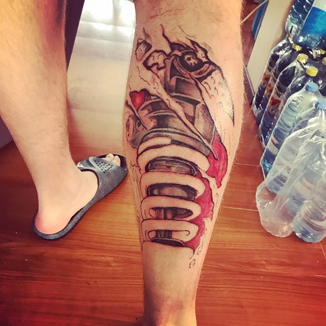 Biomechanical tattoo on the right calf