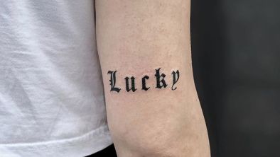 Lettering tattoo on right hand