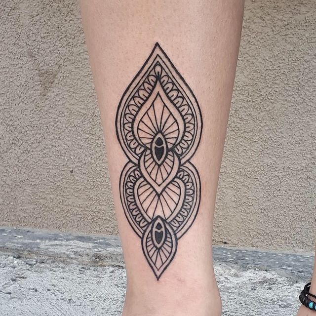 Mandala tattoo on a leg