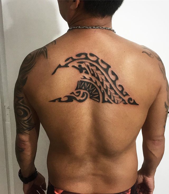 Maori tattoo of a wave on the back