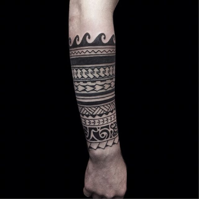 Maori tattoo on the right arm