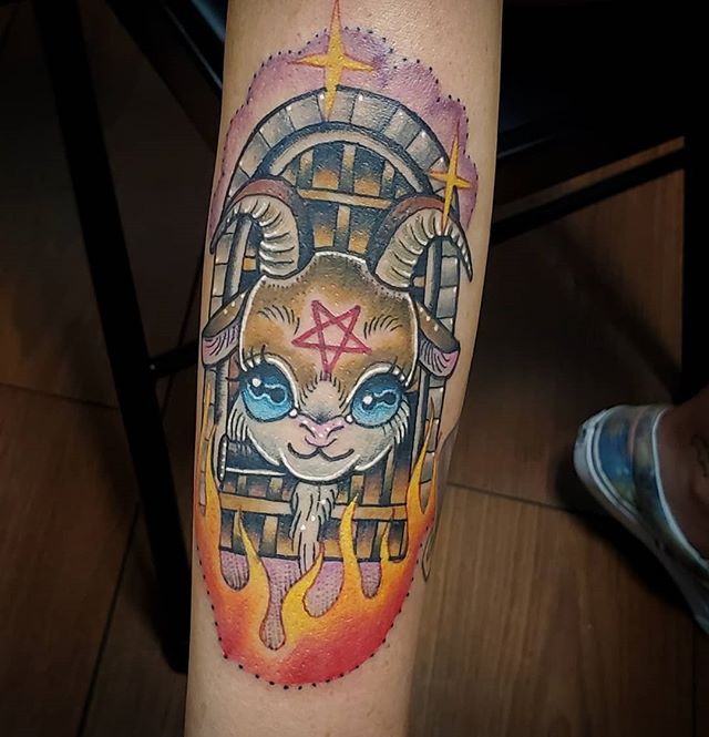Neotraditional tattoo of a satanic goat in front of the door to hell on the right leg