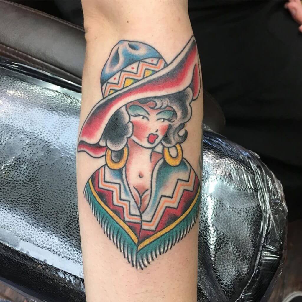 Color tattoo of a animated girl with hat