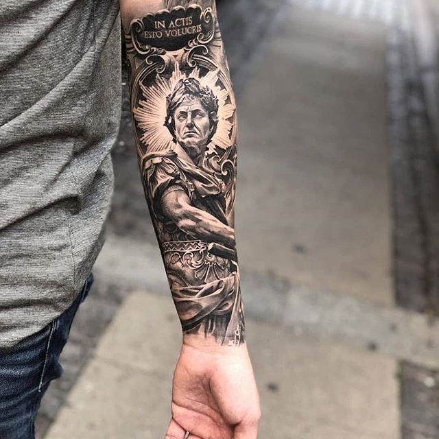 Realistic tattoo of Julius Caesar on the left arm