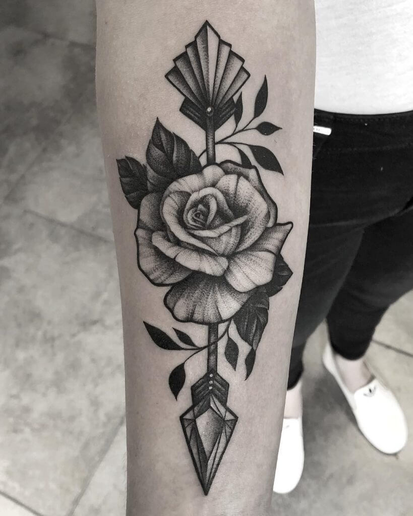 Dot work rose tattoo on the right forearm