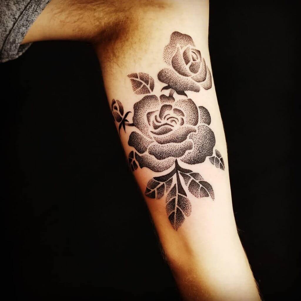 Dot work rose tattoo on the left arm