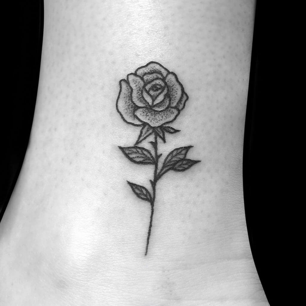 Dot work rose tattoo on the left feet