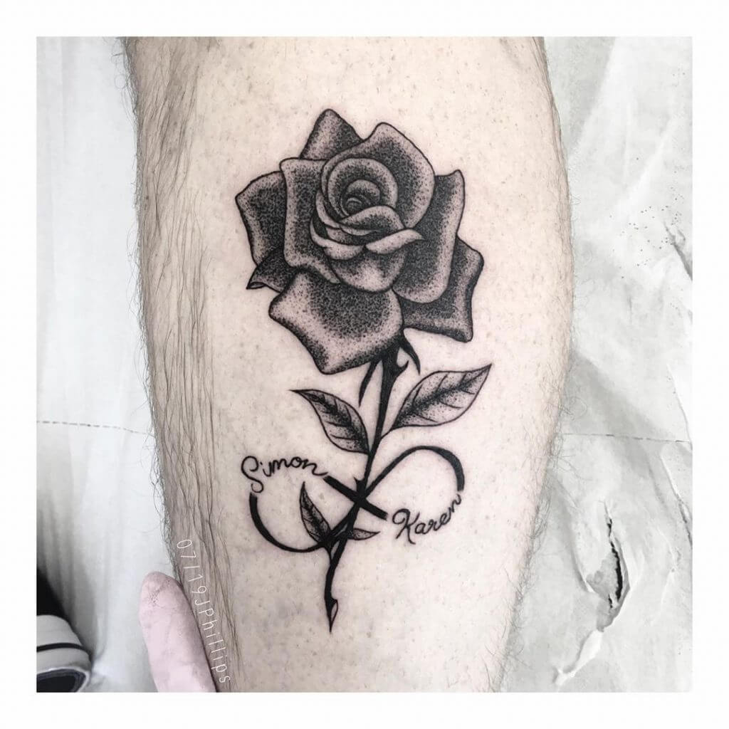 Dot work rose tattoo on the right calf