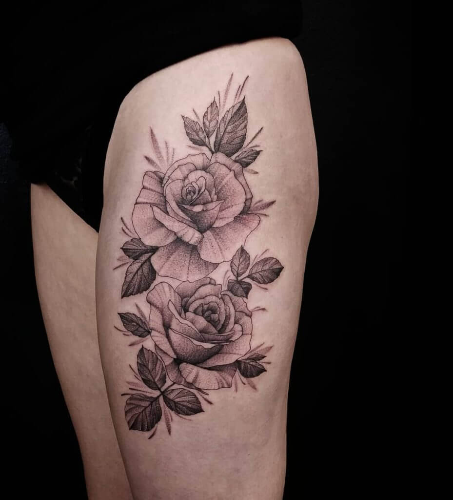 Dot work rose tattoo on the left thigh