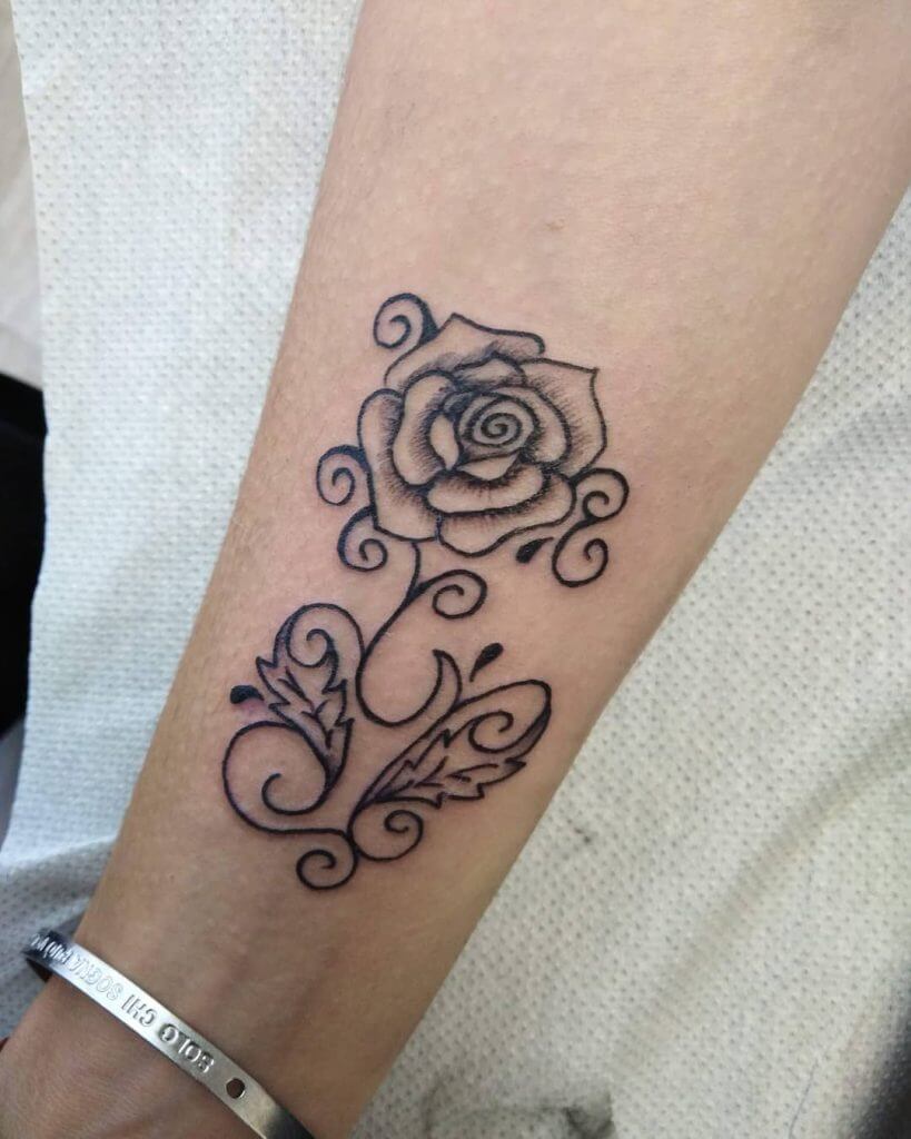 Black Rose tattoo on the right forearm