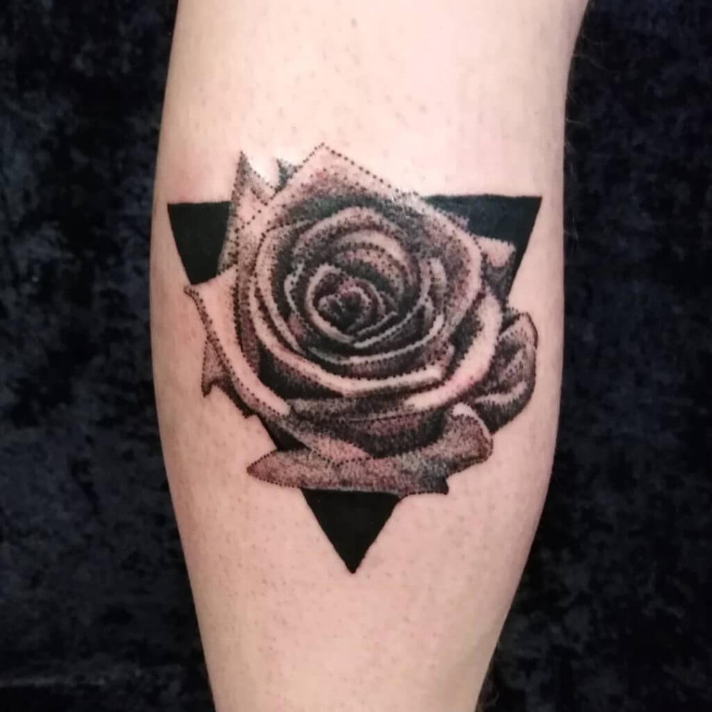 Dot work rose tattoo on the right leg