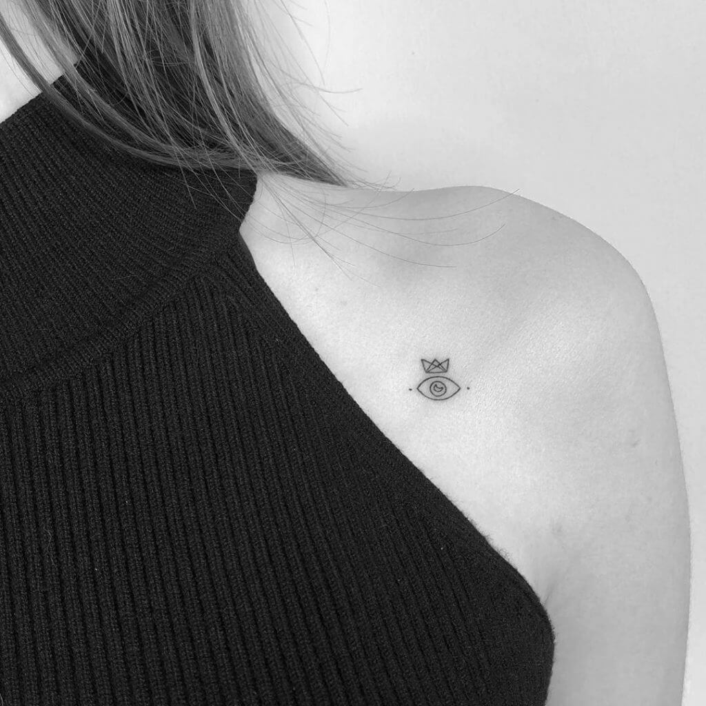 Small Black tattoo of on the left shoulder