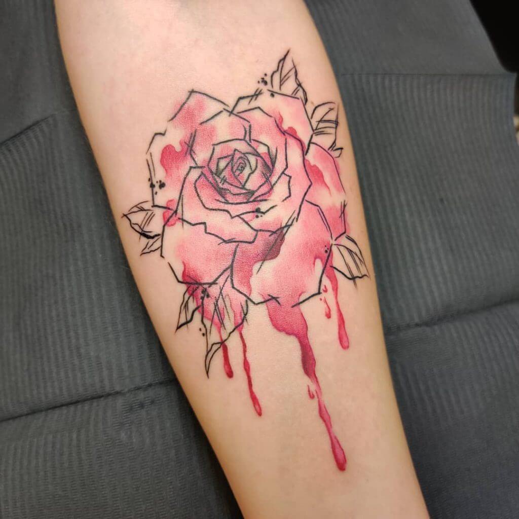 Watercolor Rose tattoo on the left forearm
