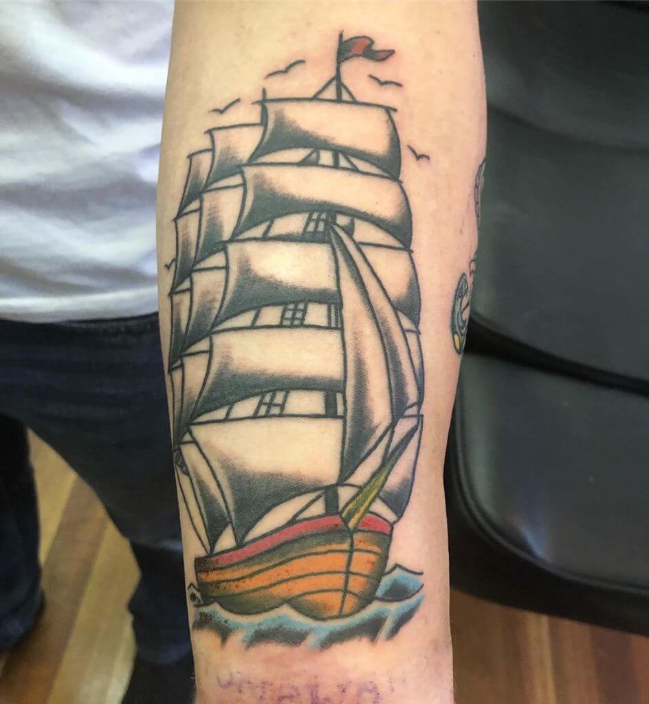 Color Forearm tattoo of a boat