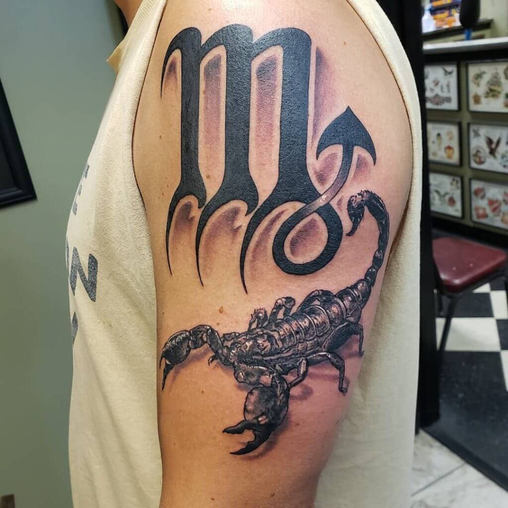 Black Male tattoo of a scorpion on the left shoulder