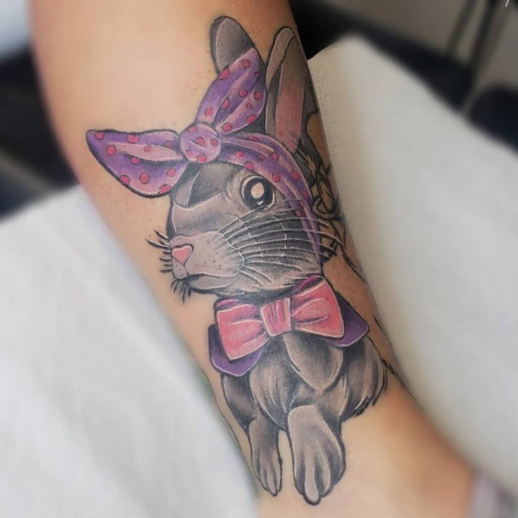 Color Bunny tattoo on the right forearm