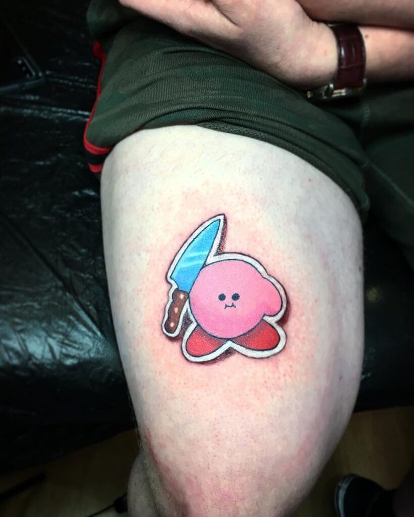 Sticker tattoo of Kirby on the right thigh