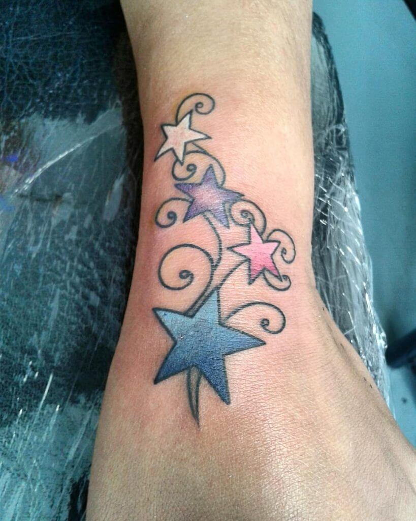 Color Stars tattoo on the left forearm
