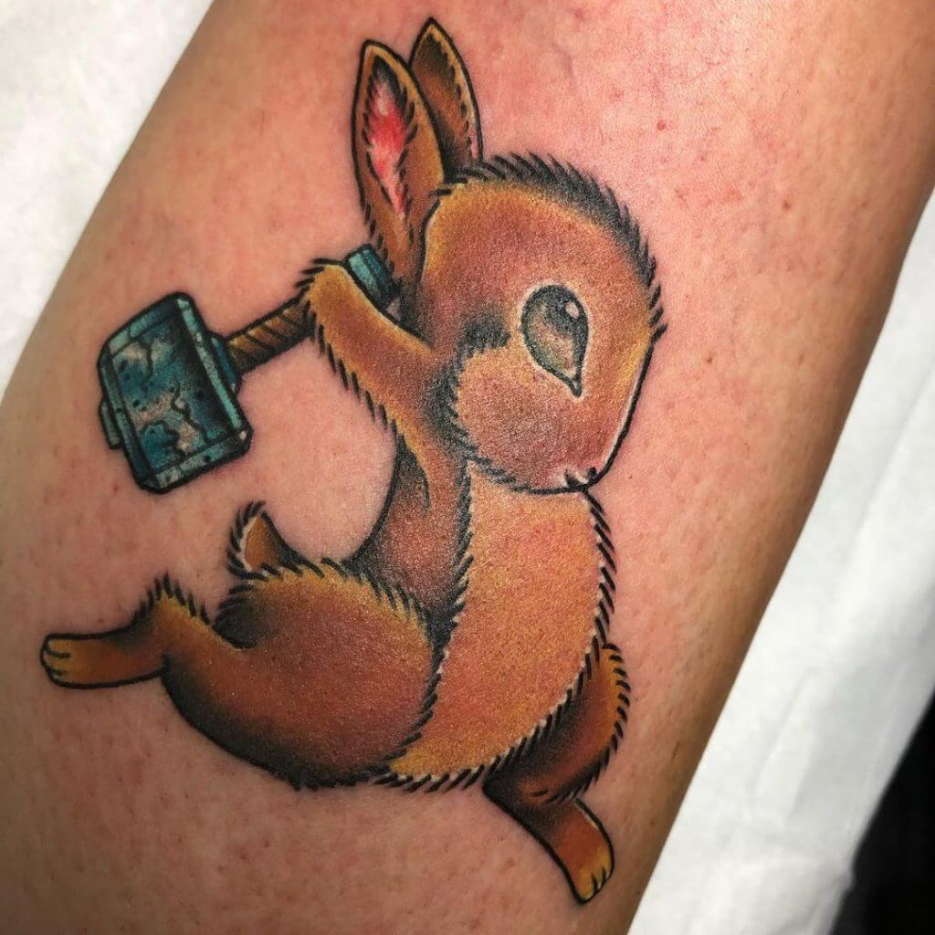 Color Bunny tattoo with a hammer