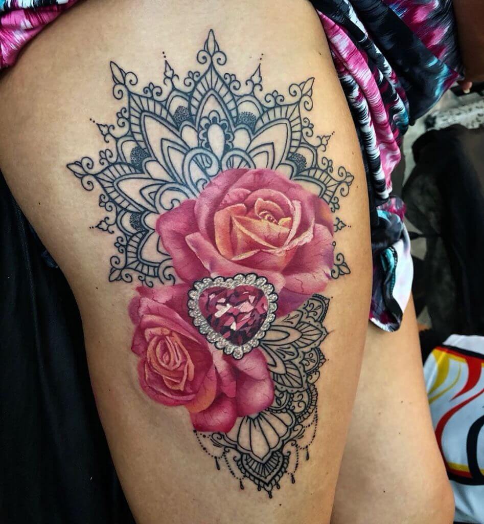 Color Rose tattoo with diamond heart on the right thigh
