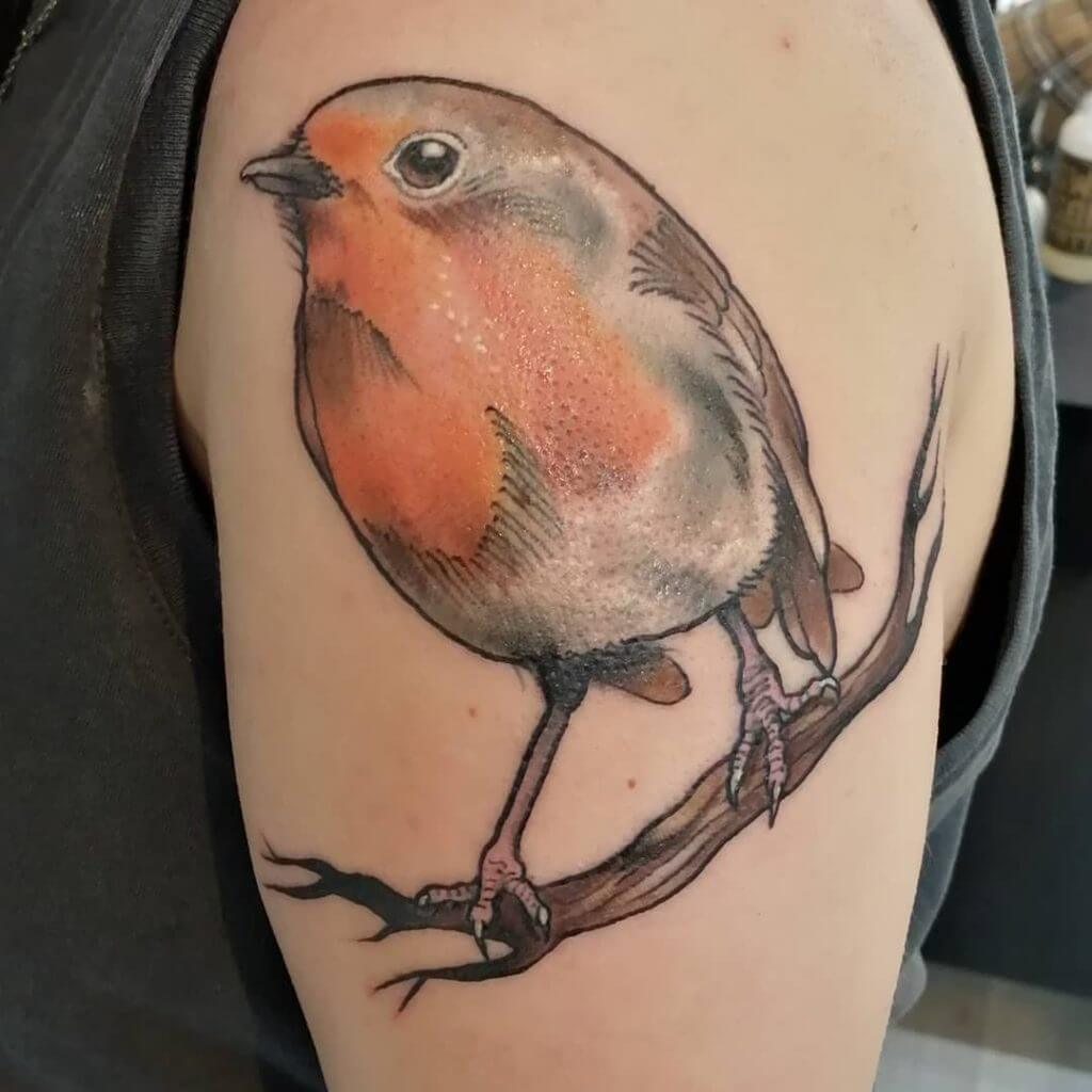 Color Bird tattoo on the left shoulder