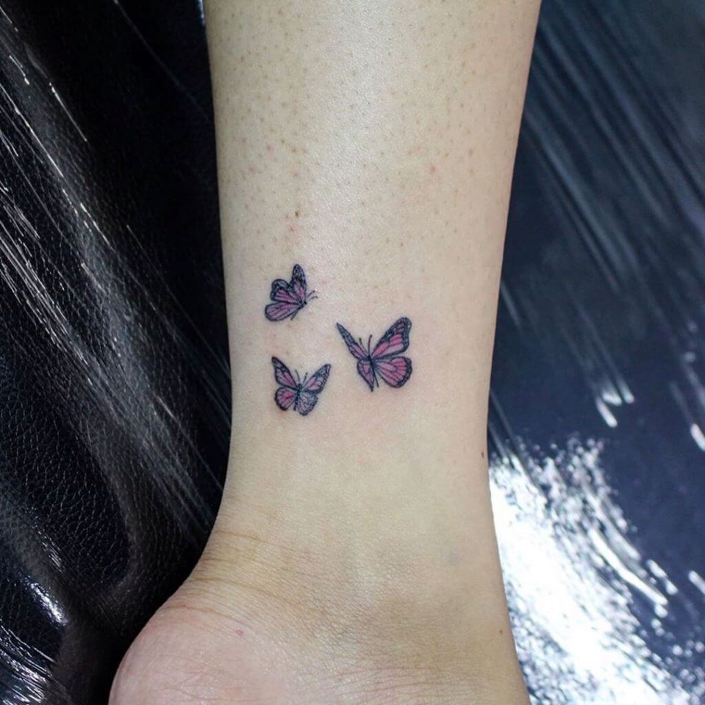 Small Color tattoos of butterfly on the left foot