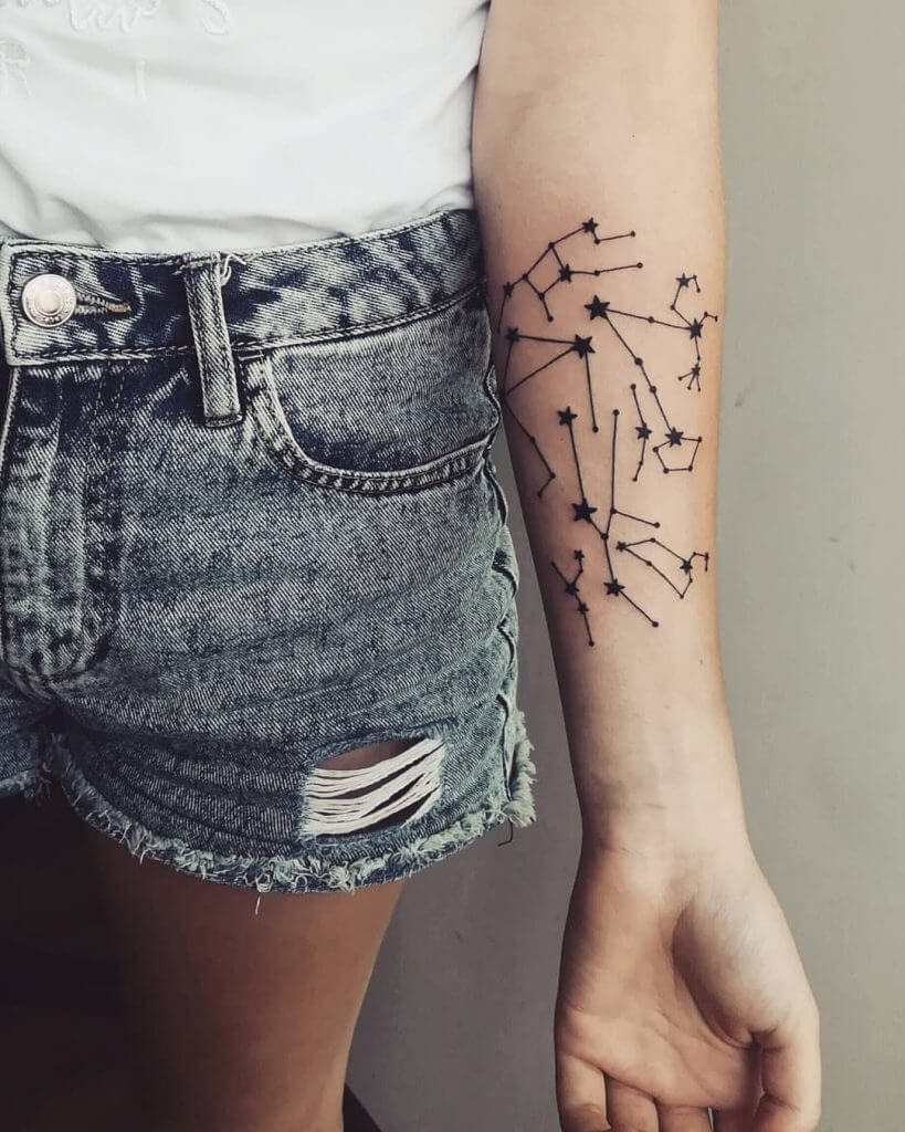 Black Stars tattoo on the left forearm