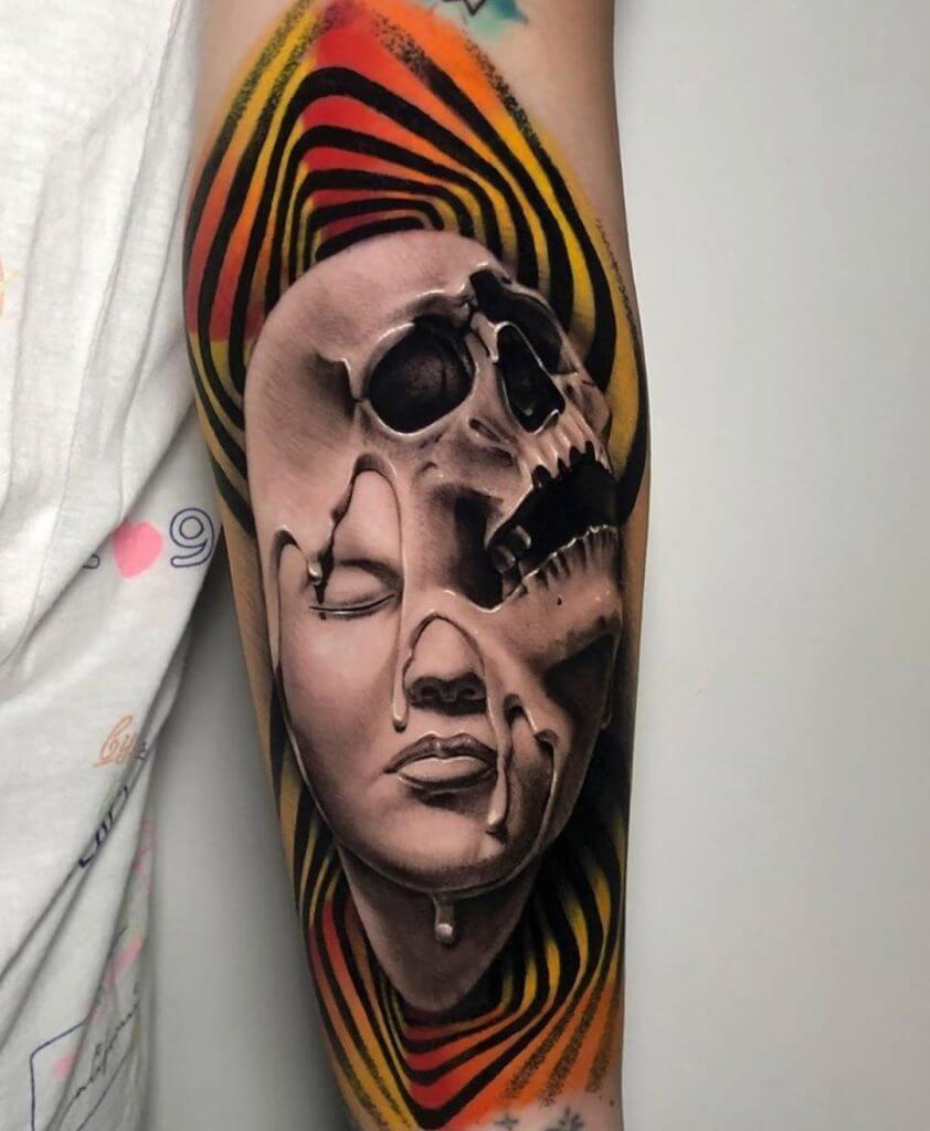 Forearm tattoo of a female with skull on her face