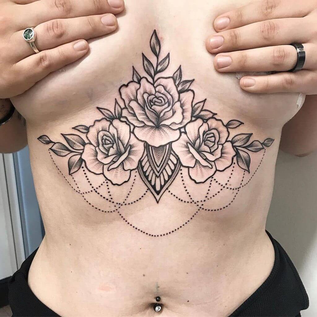Black Female tattoo of roses on the chest