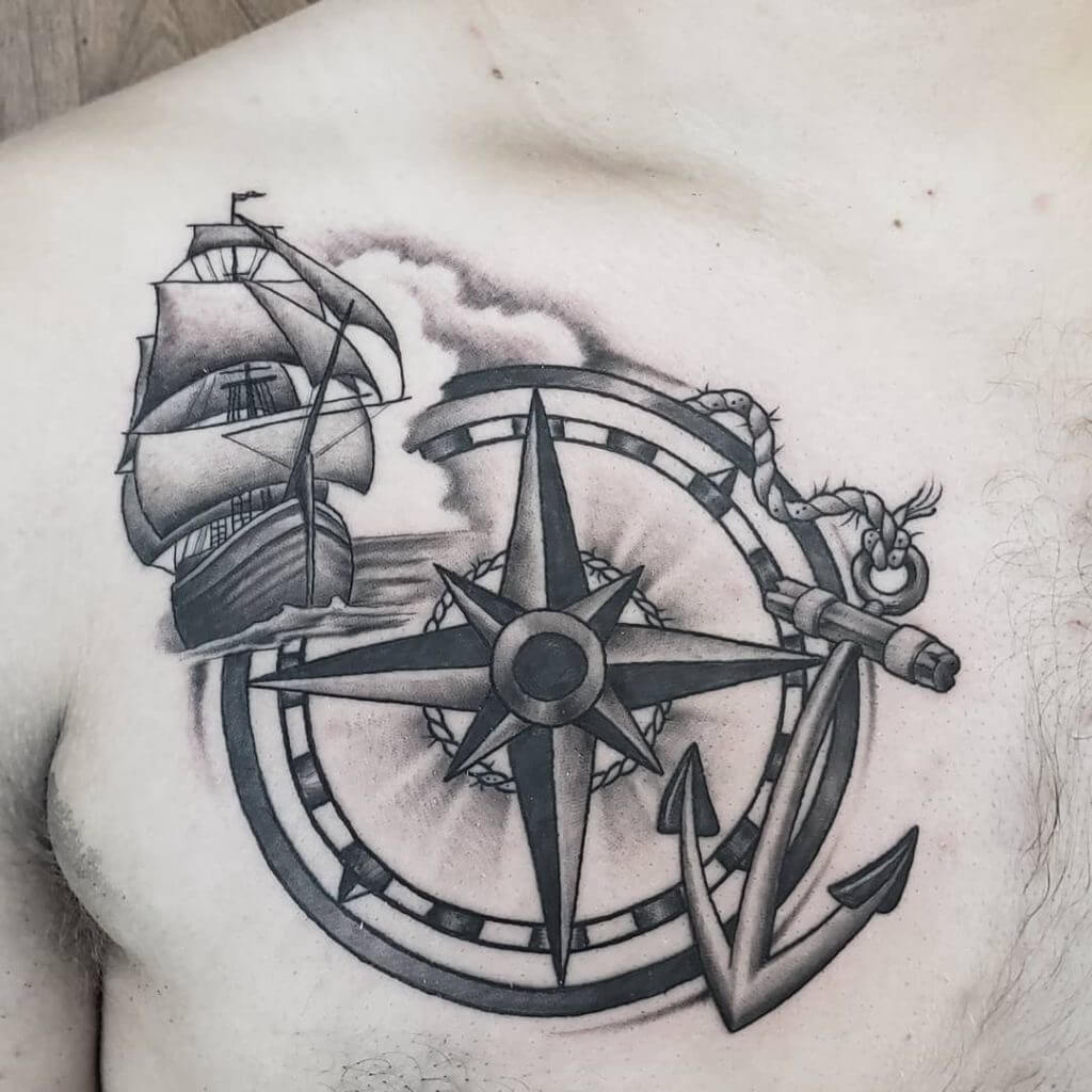 Black Anchor tattoo with a compass and a boat on the right chest