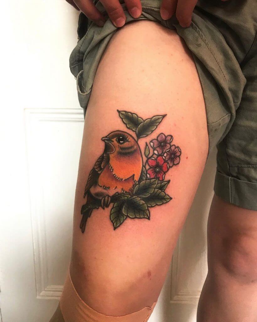 Color Bird tattoo on the right thigh