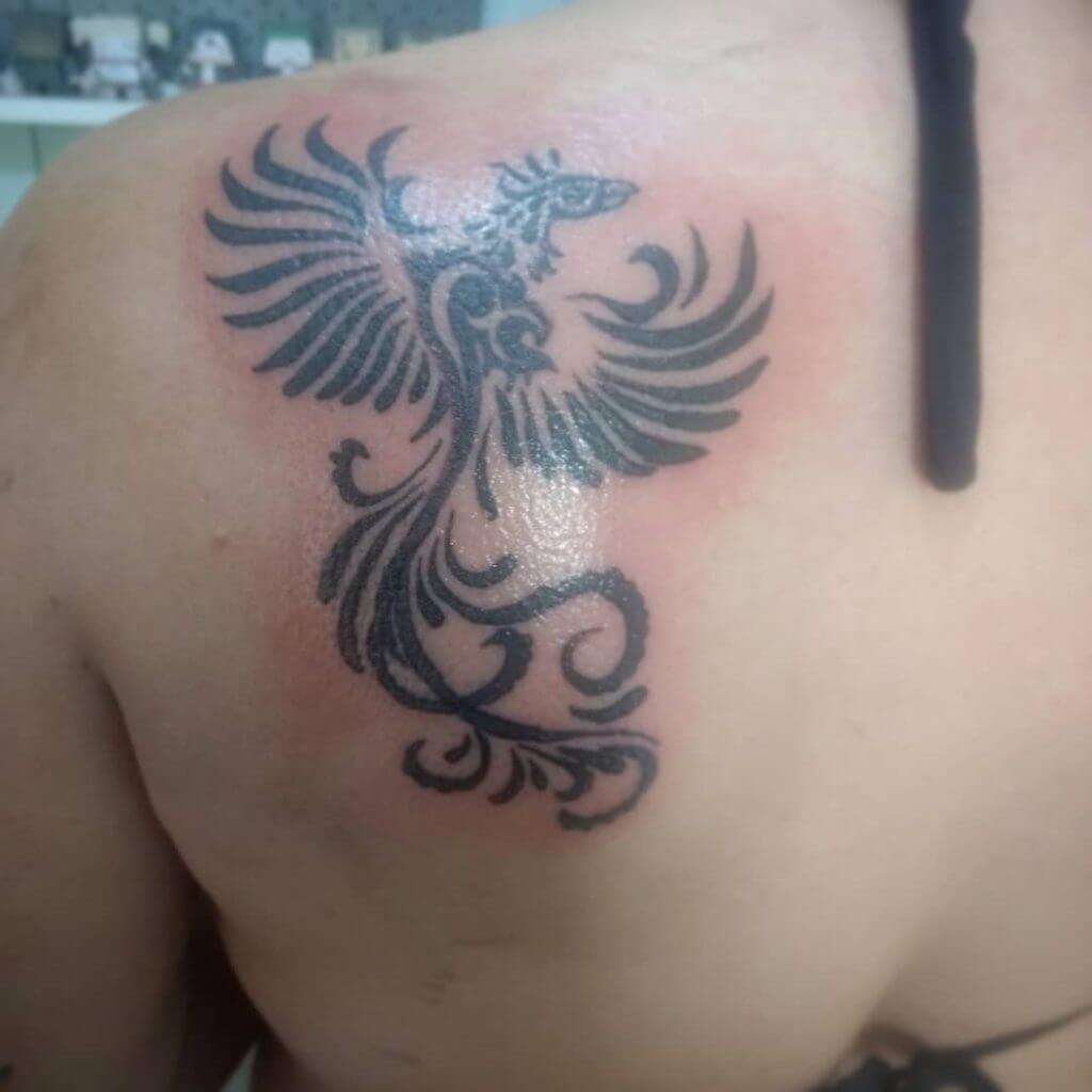 Black Bird tattoo on the back