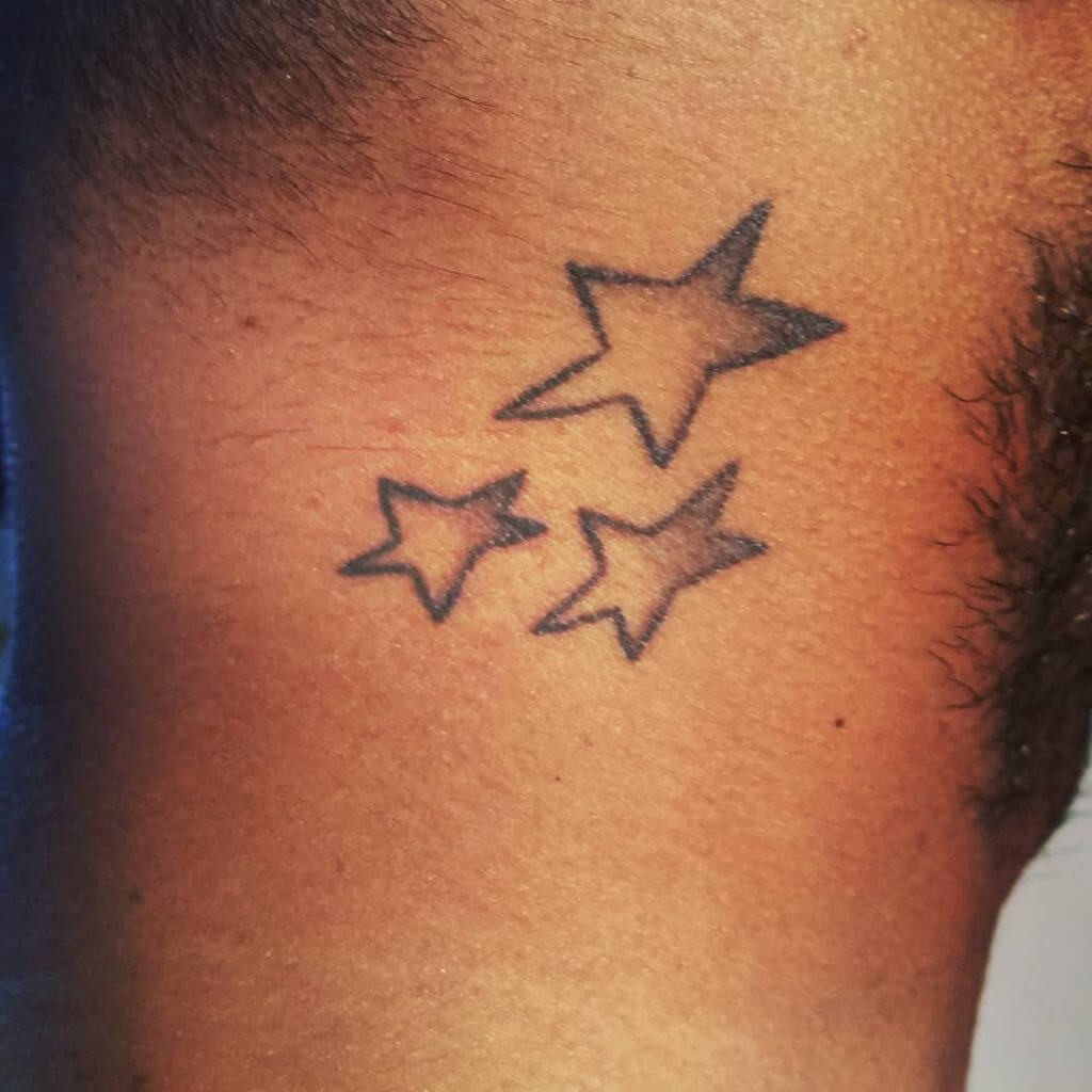 Black Stars tattoo on the hair line