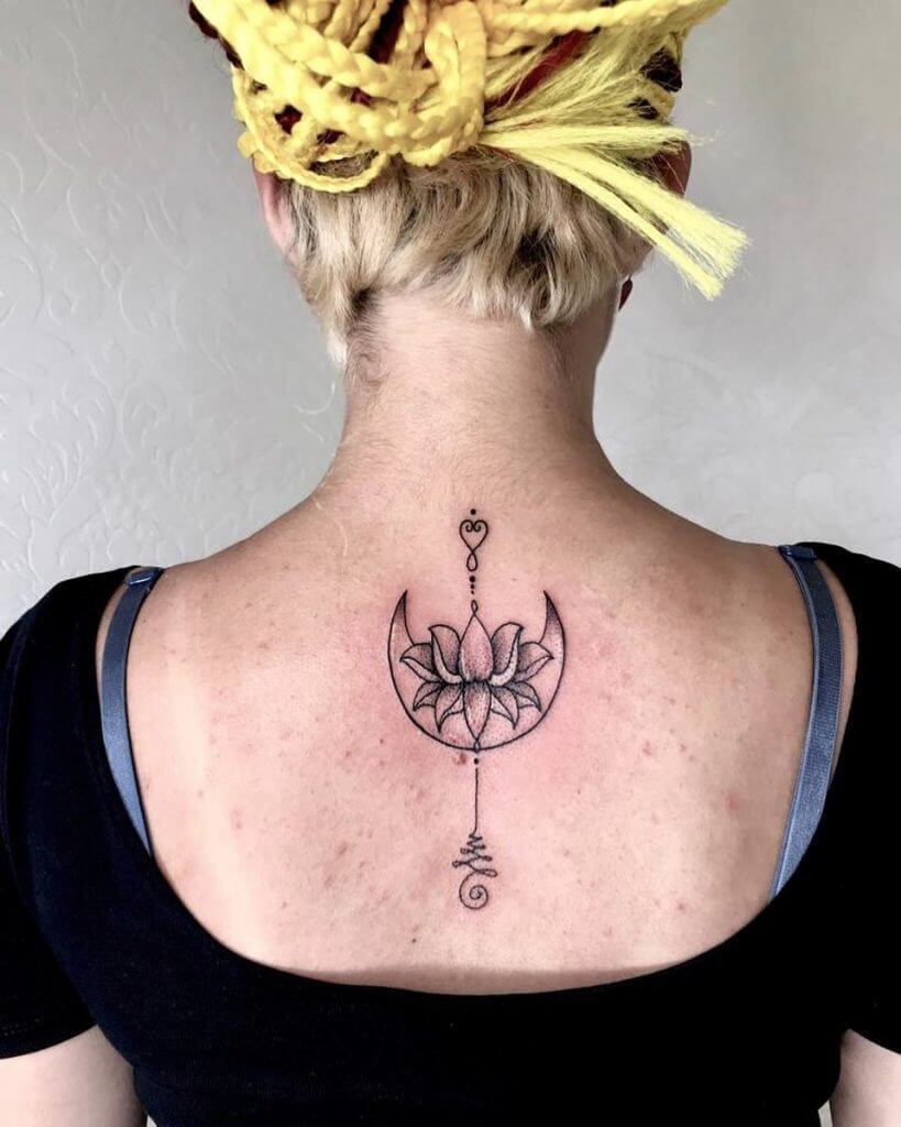 Black Female tattoo of a Mandala rose on the back