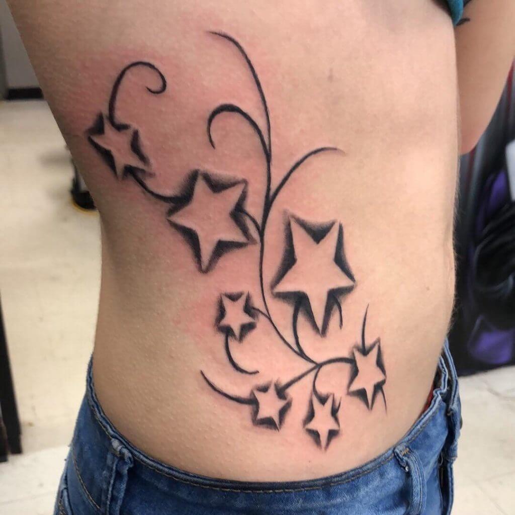 Black Stars tattoo on the ribs