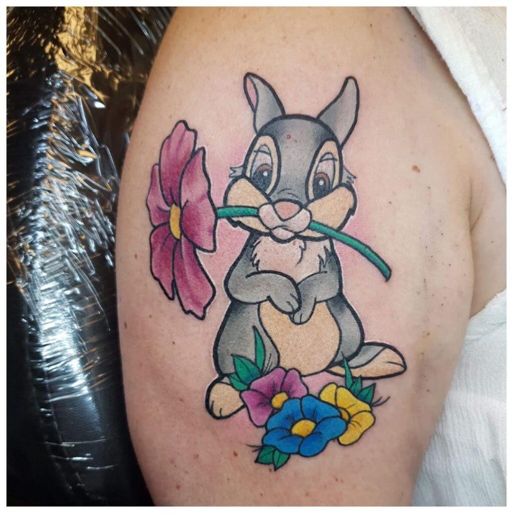 Color Bunny Thumper tattoo with flowers on the right shoulder
