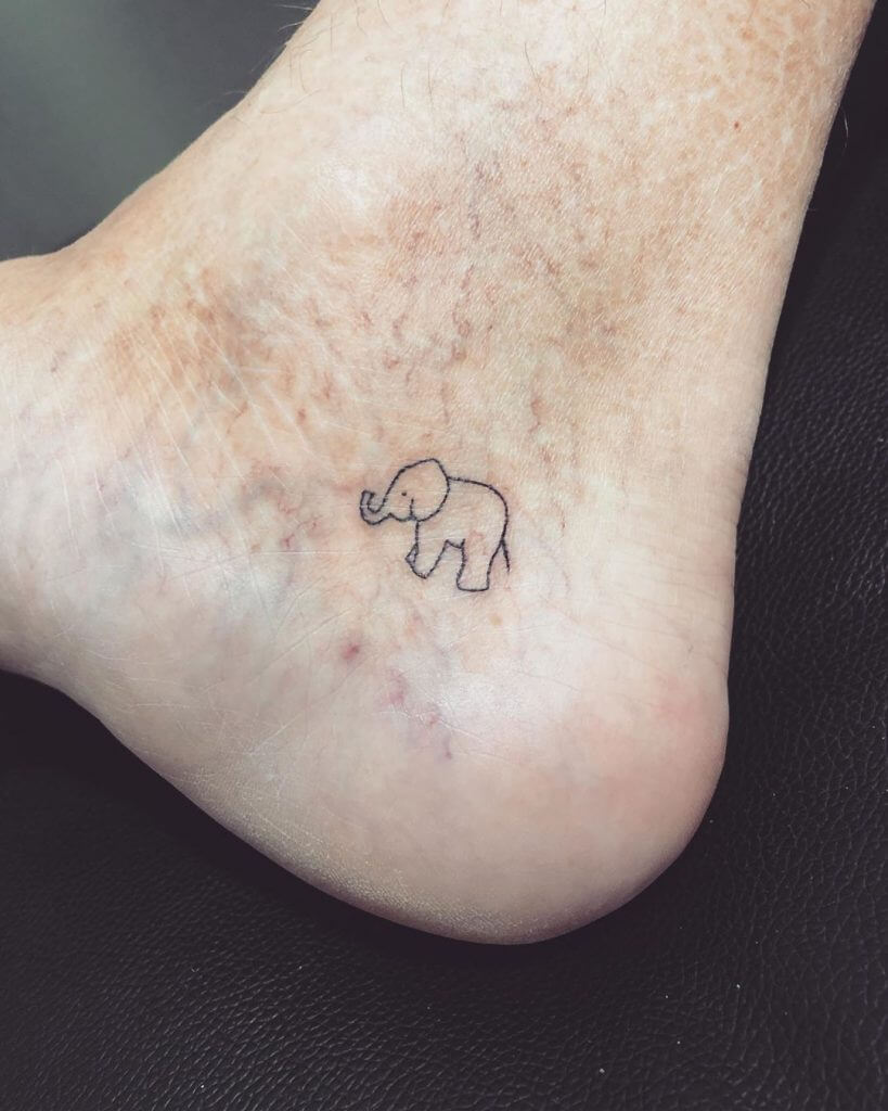 Small Dotwork tattoo of an elephant on the right foot