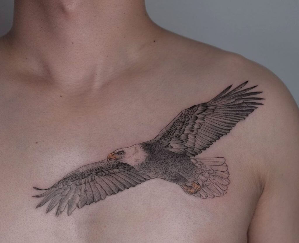 Bird tattoo of an eagle on the left collar bone