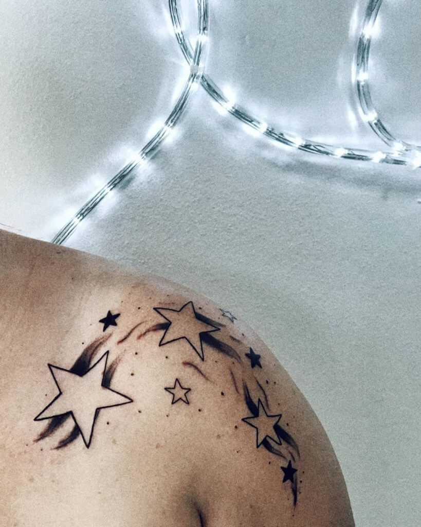 Black Stars tattoo on the left shoulder