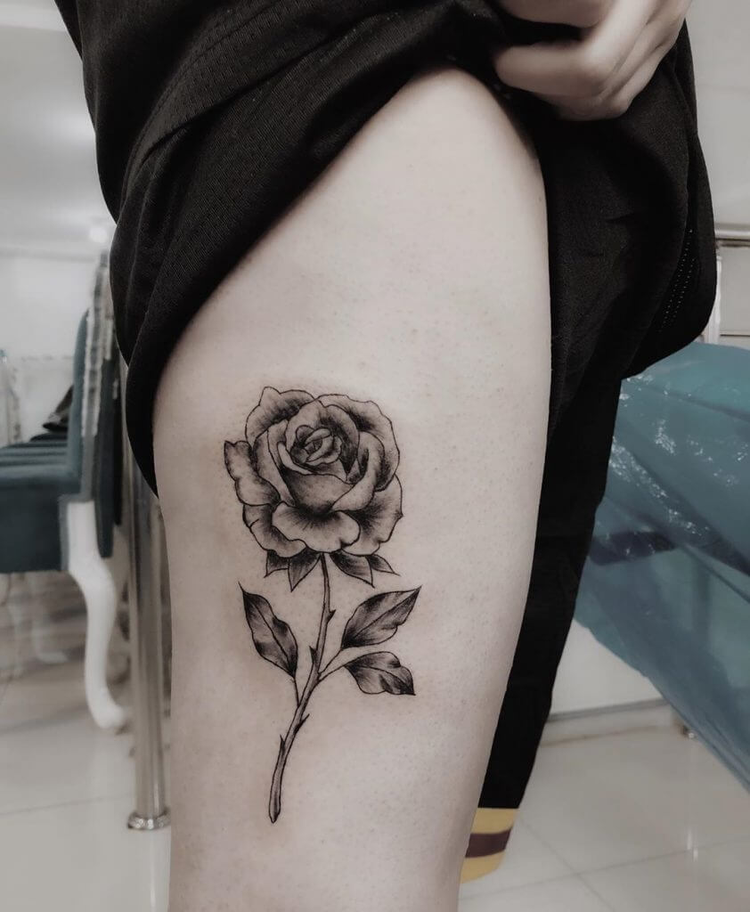 Black Rose tattoo on the right thigh