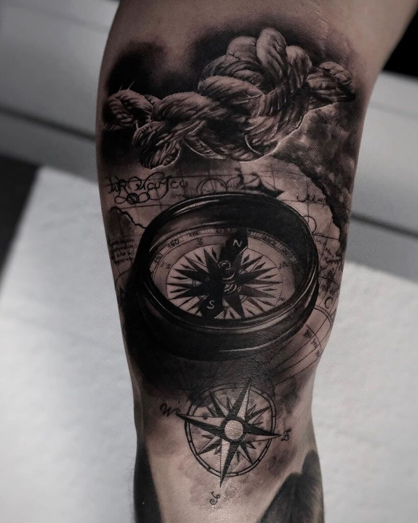 Black Compass tattoo on the right forearm