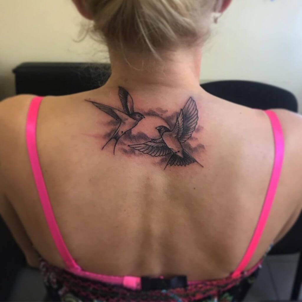 Black and Gray Bird tattoo of swallows on the back