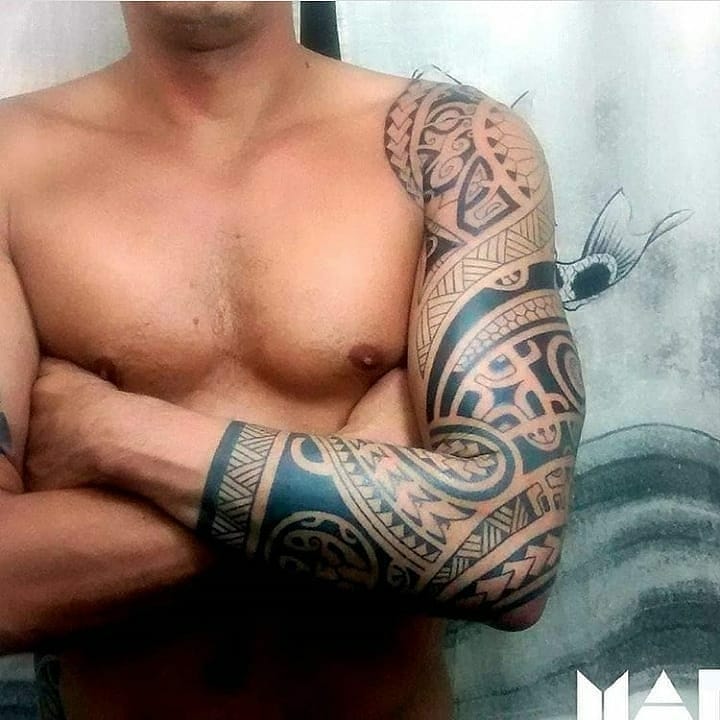 Tribal Mens tattoo on a whole left arm